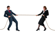 stock-photo-43961564-businessman-and-woman-tug-of-war-isolated-on-white
